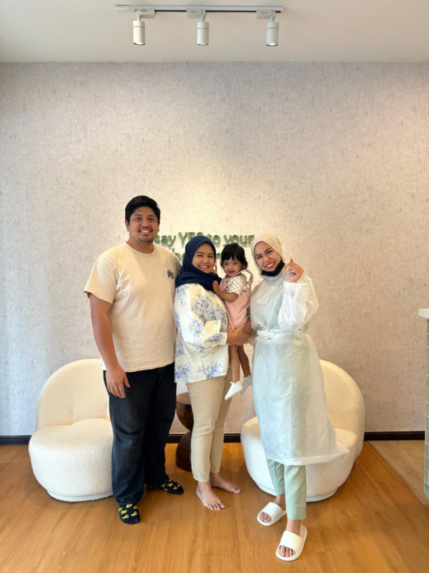 Family photo with YES Dental staff in the clinic lobby