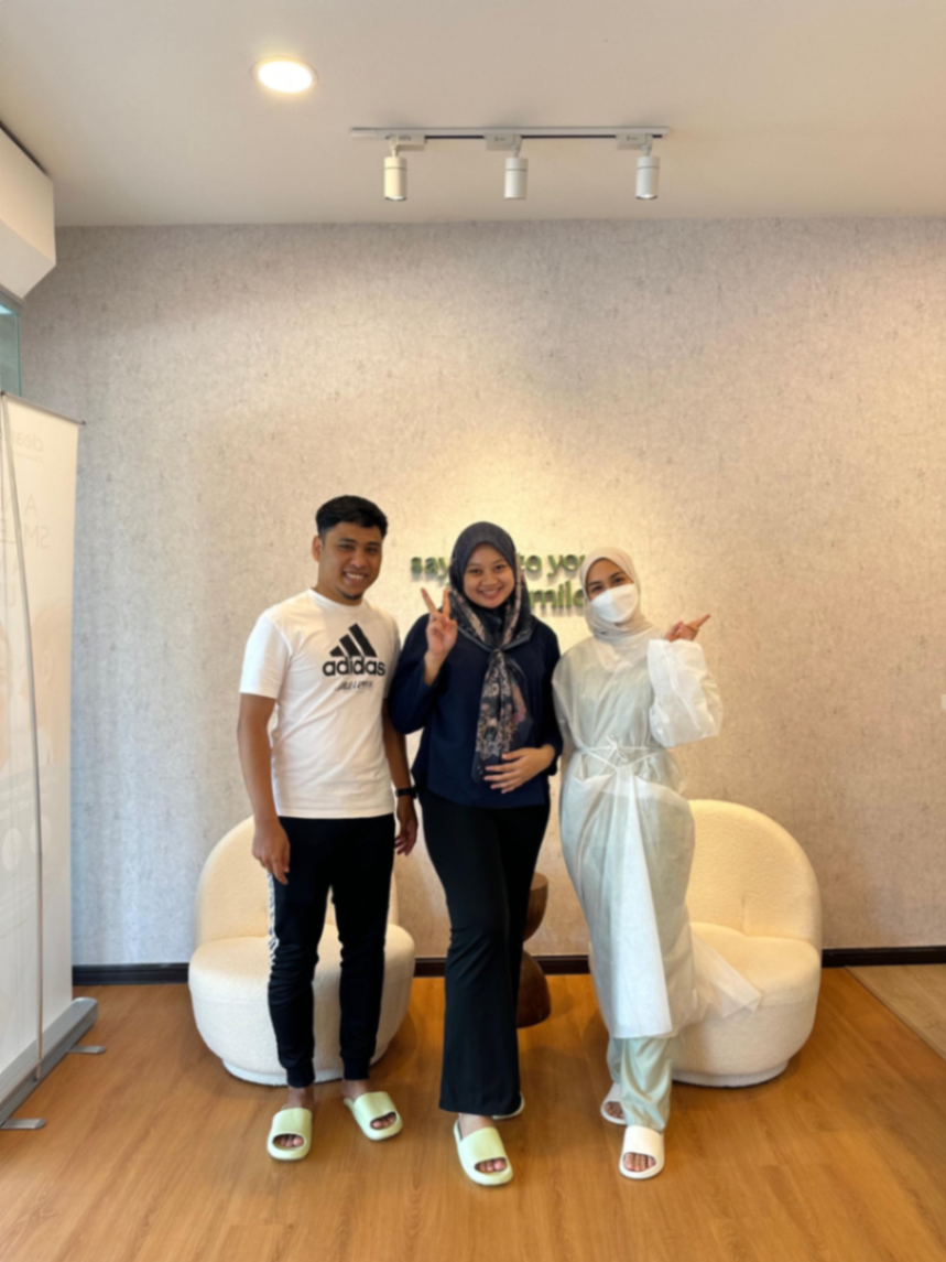 Patients and YES Dental staff posing together after treatment